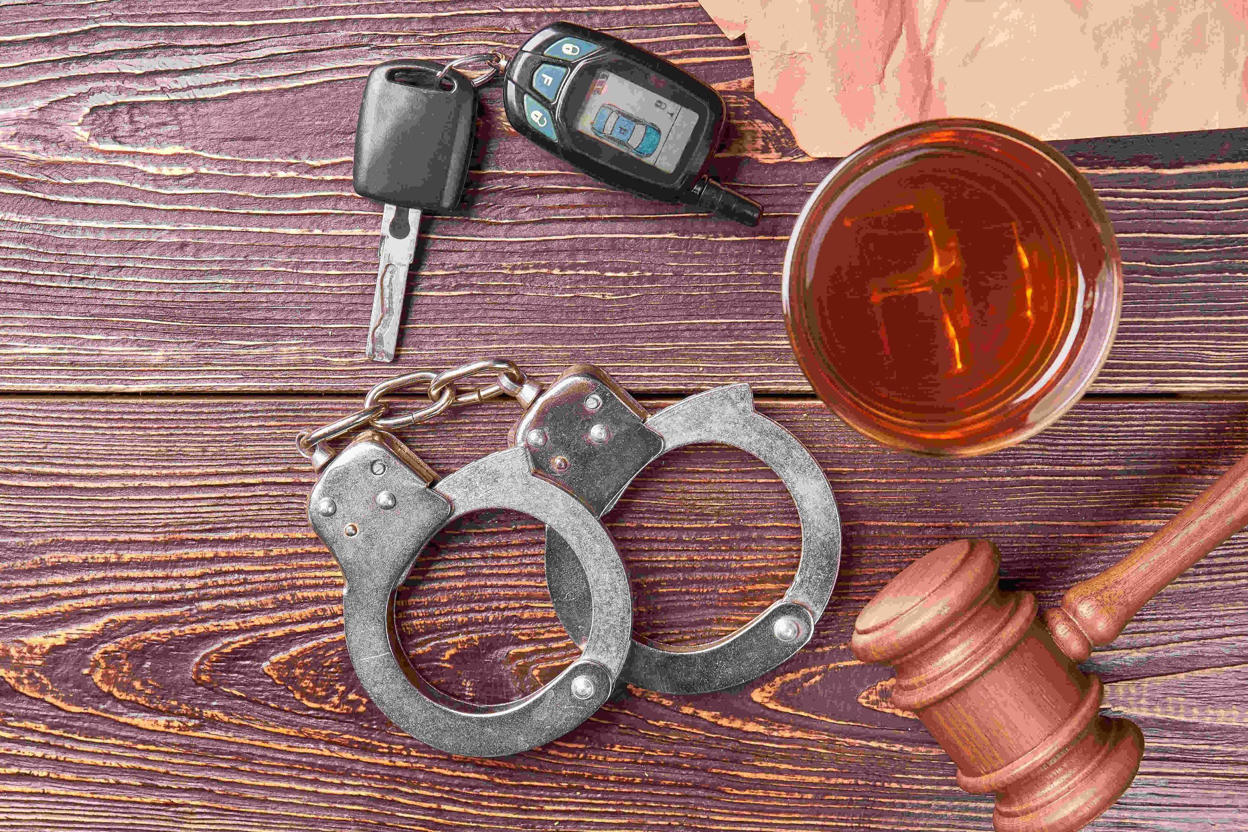 gavel-key-handcuffs-whiskey-top--scaled.jpg